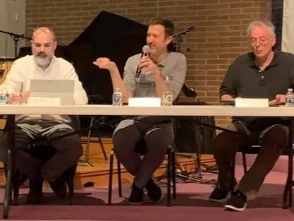 Clarendon Hills Trustee Chris Lang speaks during a discussion about downtown last week. He is next to trustees John Weicher (left) and Ralph DeAngelis.