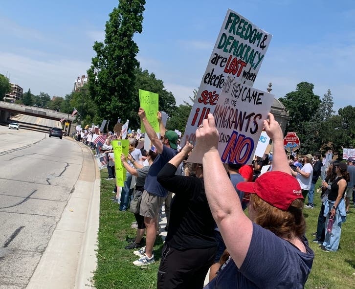 A "No Kings" rally protesting Donald Trump was held last June in Elmhurst. A Hinsdale critic of Trump was charged last week.