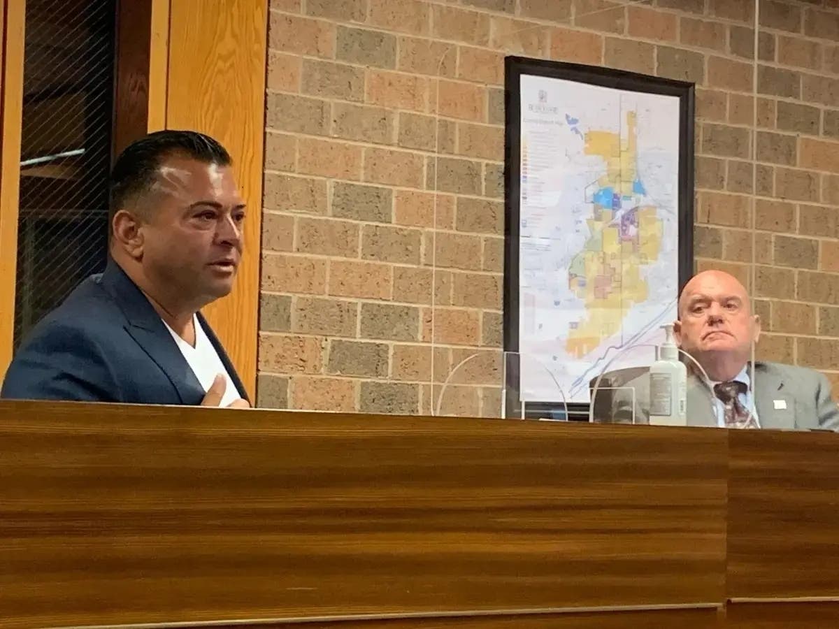 Filippo "Gigi" Rovito (left), who owns Burr Ridge's Capri Ristorante, speaks to the Village Board in 2021. Earlier this month, he was indicted for his alleged role in a gambling ring. 