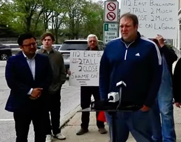 La Grange resident Jonathan Robinson last week criticized the village's handling of the local Jackson Square building. To the left is Byron Sigcho Lopez, who is running for Congress. 