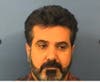 Pezhman Gilani Yahyavi, 46, of Glendale Heights, was accused of staging an armed robbery.