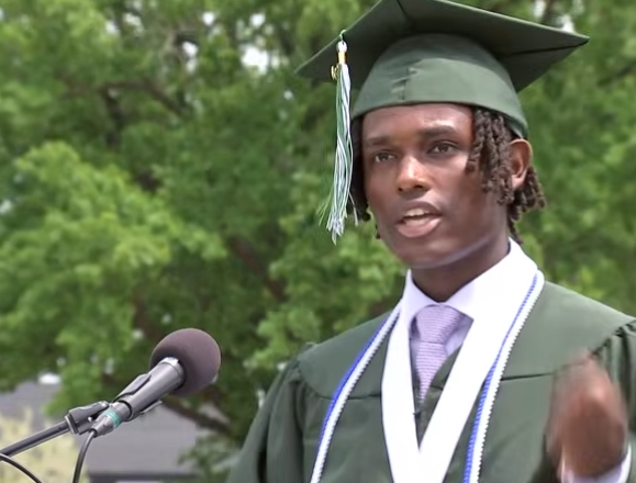York High School graduate Ricardo Morales speaks during Sunday's commencement ceremony before fainting.