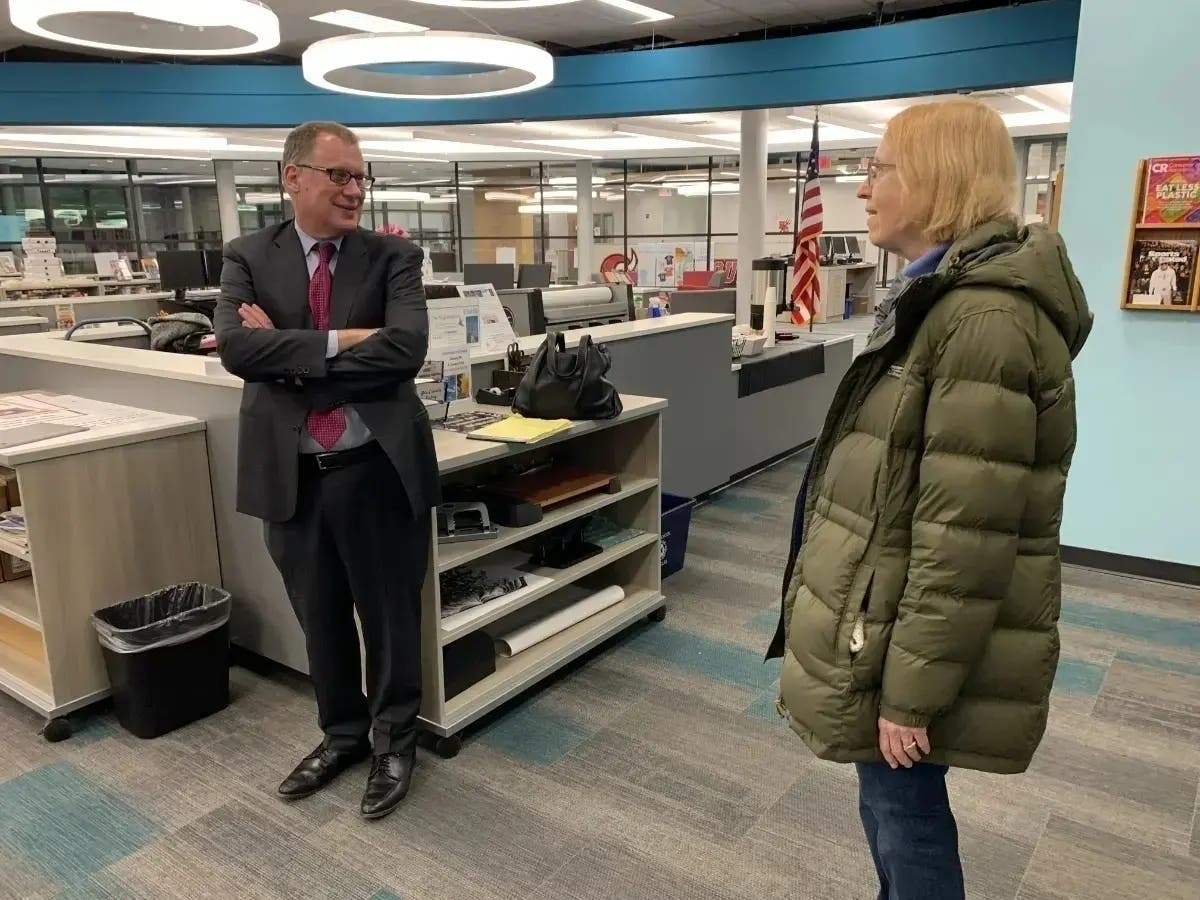 Michael Lach, then the incoming superintendent of Hinsdale High School District 86, speaks with resident Linda Burke during a January 2024 meet-and-greet before taking the district's helm.