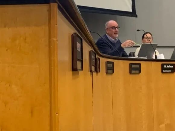 Mark Hoffman, a member of the Elmhurst Zoning and Planning Commission, asks a warehouse developer a question during a meeting earlier this month.