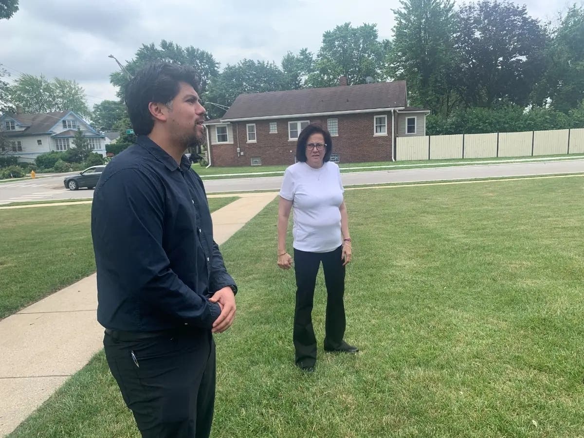 Addison Township Supervisor Bobby Hernandez and Maria Vesey, the township's clerk, speak about their new jobs in an interview last summer outside the township's Addison offices. 