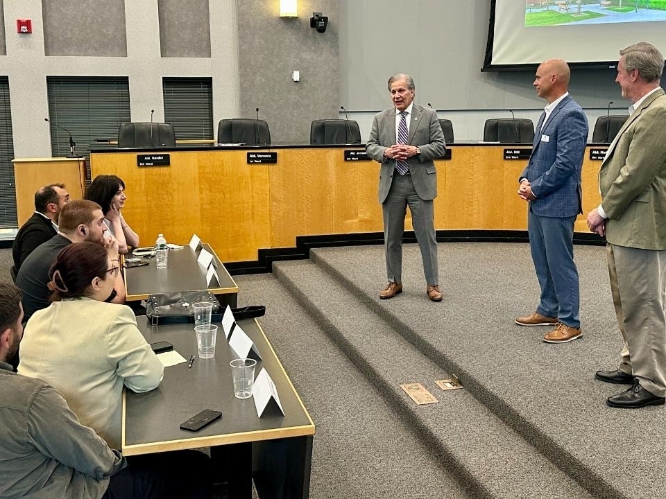 From left, Elmhurst Mayor Scott Levin, Assistant City Manager Kent Johnson and former Alderman Bob Dunn speak last week to emerging leaders from Georgia, which is south of Russia.