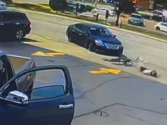 A 10-year-old electric motorcycle rider suffered minor injuries after he crashed into a car last weekend in Elmhurst, police said. In this screenshot, the boy is seen on the ground. 