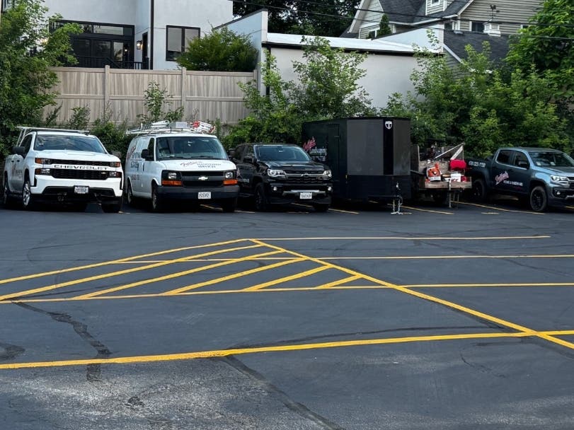 Commercial branded trucks and trailers from Fuller's Home & Hardware in downtown Hinsdale were often parked overnight at Zion Lutheran Church, a few blocks away.