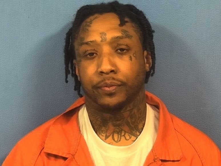 Sterling Boston, 33, was charged with the felonies of possession of drugs with the intent to deliver and unlawful possession of a gun by a felon, police said.