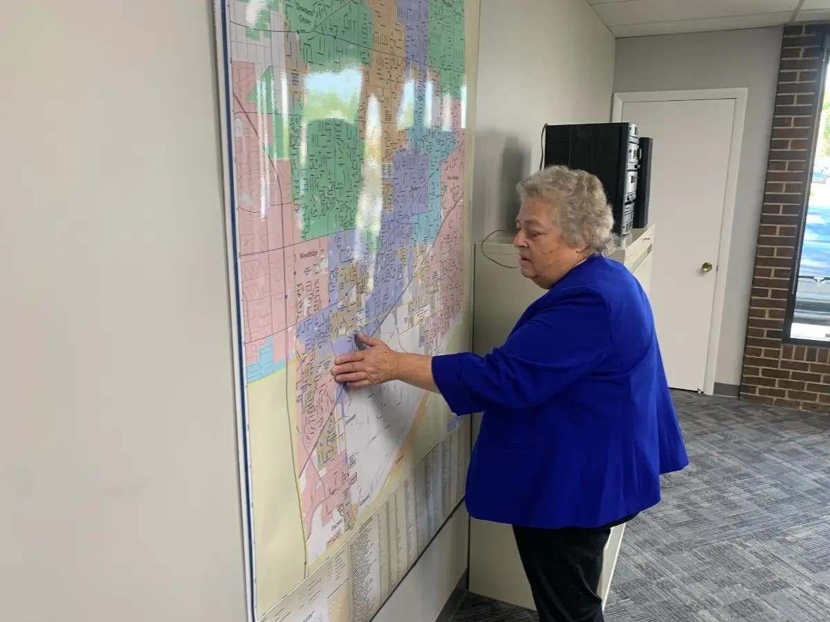 Downers Grove Township Supervisor Kim Savage looks over a map last year in the township office. This week, Downers Grove put a tax increase proposal on the November ballot. 