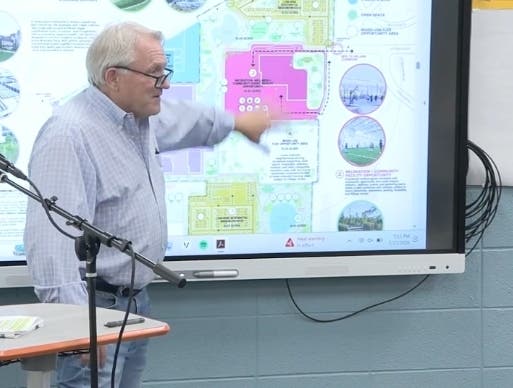 Mike Stratis, a member of Burr Ridge's Plan Commission, speaks out against the village's plan for a 110-acre site, including a proposed athletic facility. 