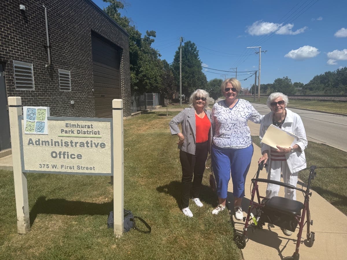 Elmhurst residents Donna Geis, Andrea Hutchinson and Claire Cronin deliver a petition last week to the Elmhurst Park District office. They want to put the location of the Wilder Park bandshell on the November ballot.