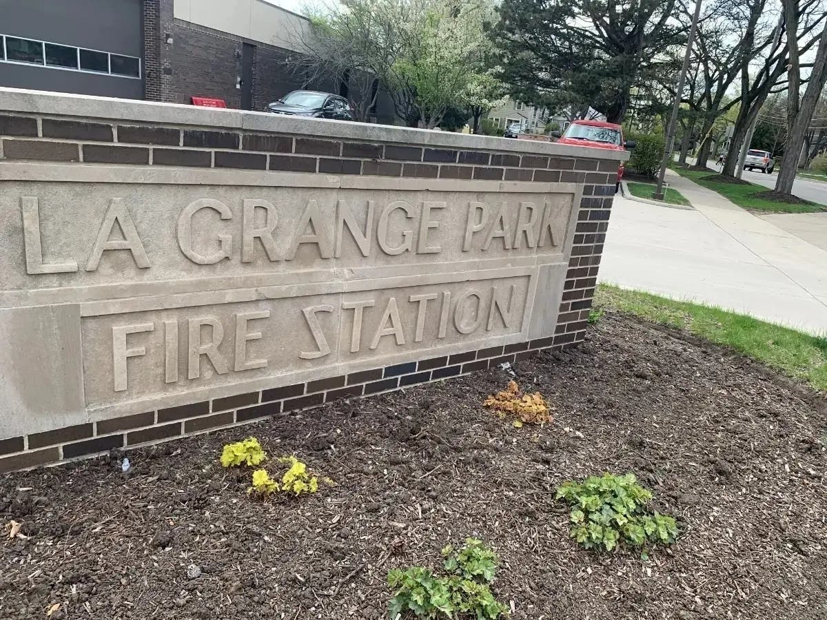 La Grange Park firefighters responded to four car fires at a local business after a utility pole fell Tuesday, officials said.