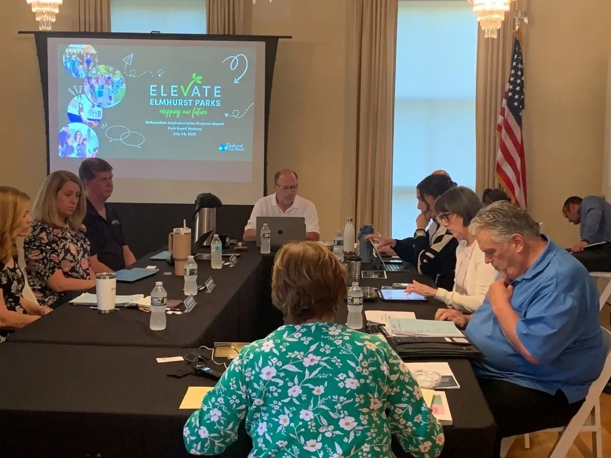 The Elmhurst Park District's board president, Kevin Graf (at head of table), is recommending putting a question about the Wilder Park bandshell's location on the November ballot.
