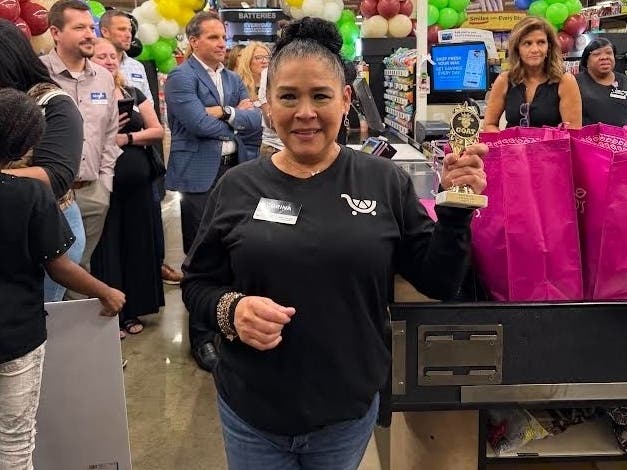 Corina Cervantes, a Mariano's employee in Western Springs, holds her Bag-Off competition award. She is set to compete next week at the State Fair in Springfield. 