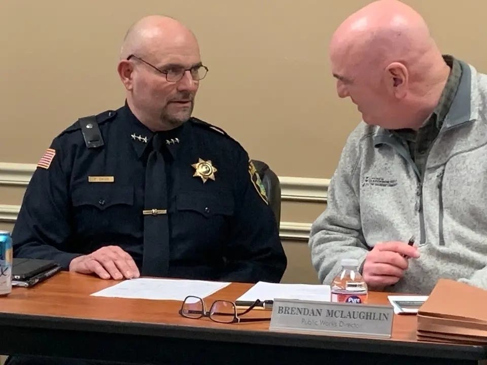 Brendan McLaughlin (right), Clarendon Hills' public works director, is seen here speaking with then-Police Chief Paul Dalen before a 2024 Village Board meeting.