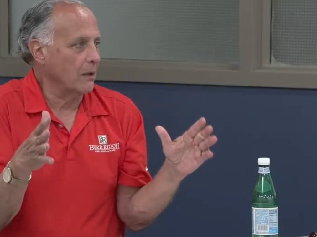 Burr Ridge Mayor Gary Grasso speaks Monday about eliminating the village's property tax. It would be offset by hiking the sales tax.