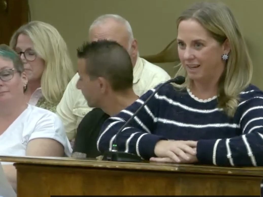 La Grange resident Laura West tells village officials Monday that flooding will only get worse if the village doesn't act.