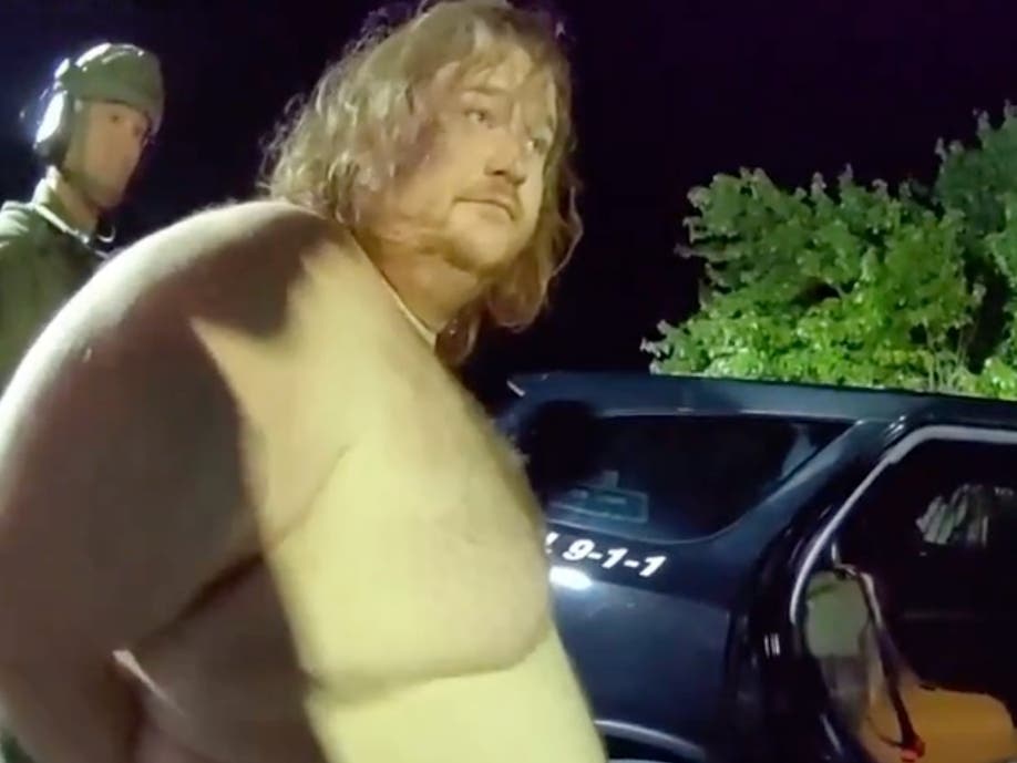 Officers put Darien home invasion suspect Michael Lahey into a squad car on the night of Aug. 4 in Homer Glen.