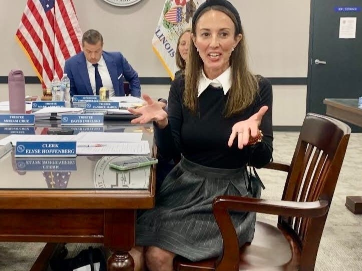 Elyse Hoffenberg, Lyons Township's clerk, speaks Tuesday about her office's programs. In the background is the township's supervisor, Christopher Getty. Earlier, he had accused her of a "complete fabrication."