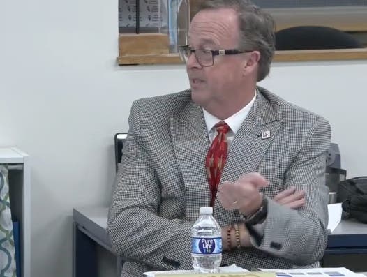 Burr Ridge Trustee Russell Smith argued against a tax hike that generated more money than he said the village needed. "Let's face it, we're not real good about holding on to our money," he said.