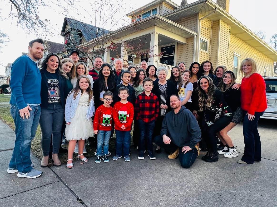 The family of Laura Gannon, who died of lymphoma three years ago, poses for a photo on Christmas Day in their driveway.