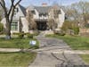 The mansion at 219 E. First St. features a limestone exterior and an elevator for all three levels.