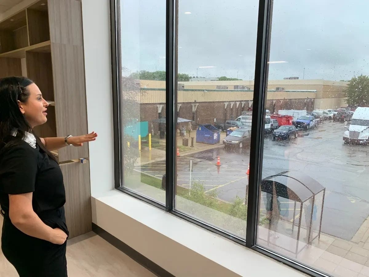 Mila Krcevinac, a Super Ego executive, looks over a parking lot full of semi-trucks in 2023. She was in the corporate headquarters' offices.
