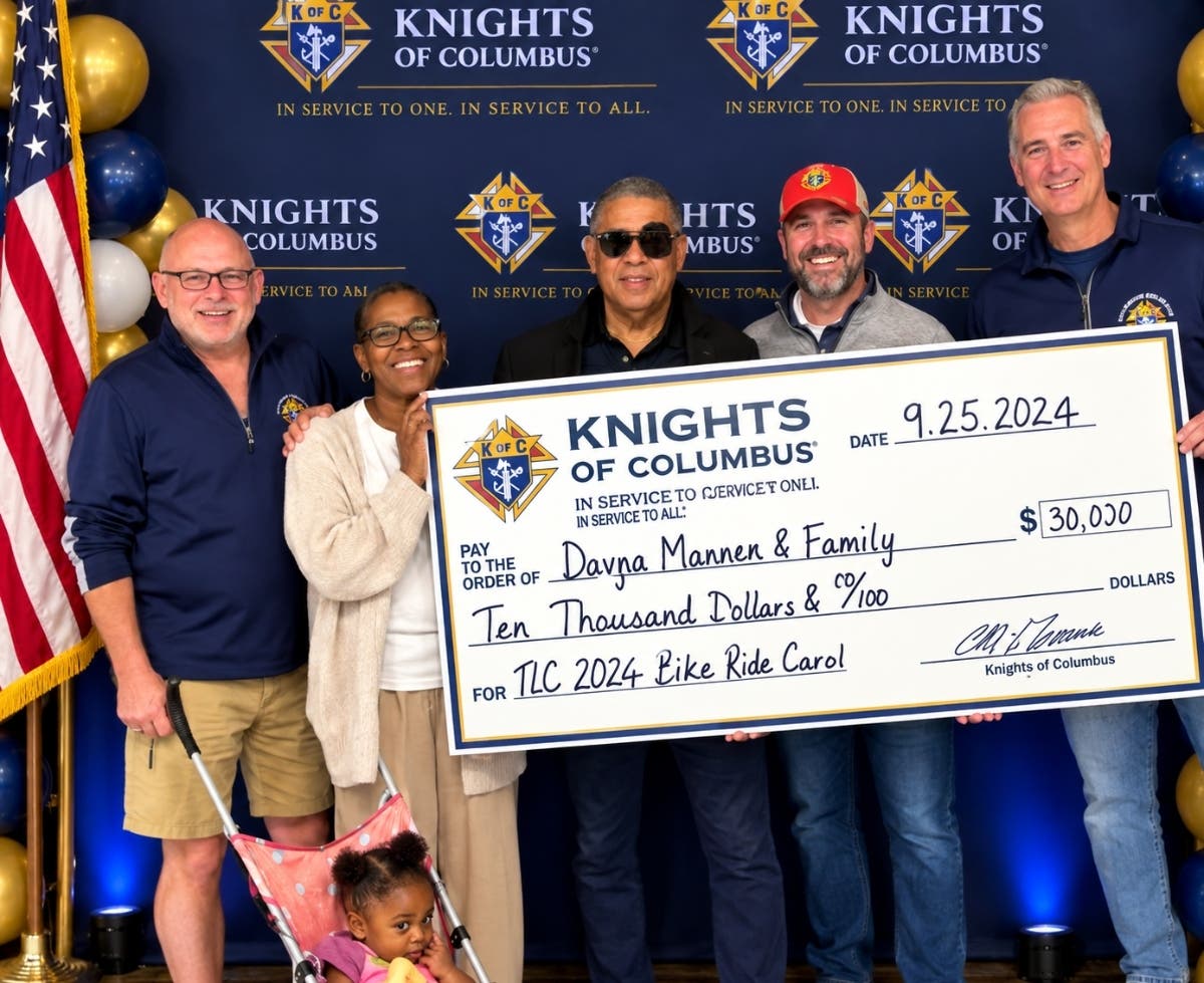 Members of Elmhurst Knights of Columbus Council 1911 present a $10,000 donation to an Elmhurst family following the July 18 Poker Bike Run. More than 100 people participated in the event to support the family.