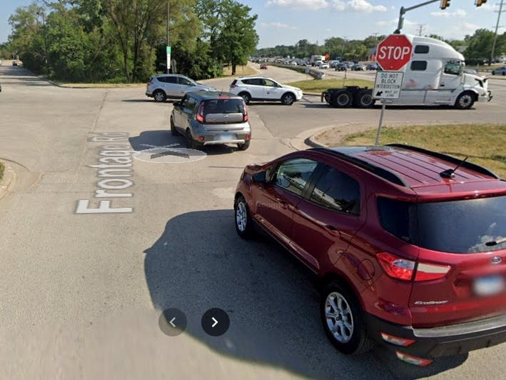 Cars queue up at the five-legged intersection in southwest Elmhurst, referred to as "The Bulb." Improvements have been delayed for another two years.