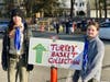 Troop Guide Jenna Hauser (L) directs donors with Scout Josephine Henry (R)