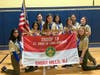 Arrow of Light Award Recipients Caroline DeSoe, Ava Legasto, and Lea McKenna with their new sisters of Troop 19. (Troop Flag - SPL Riya Tyagi and ASPL Katie Cannon)
