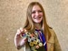 Assistant Senior Patrol Leader Katie Cannon shows off Truck Transportation Merit Badge Earned by the 17 Scouts in attendance.