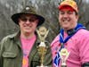 Scouts BSA Troop 19 Committee Chairman, James McKenna & Scoutmaster Daniel Cannon proudly pose with their Scout's trophies. 