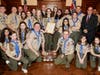Members of Troop 19 pose with members of the Essex County Board of Chosen Freeholders and framed Resolution received.