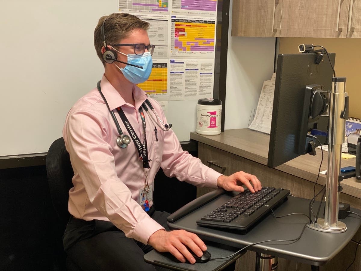 Dr. Eric Schluederberg, a Physician at Kheir Clinic, works with a patient via telehealth.