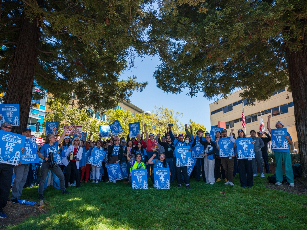 People rally in front of the UCSF Benioff Children's Hospital in Oakland om Thursday, July 9.