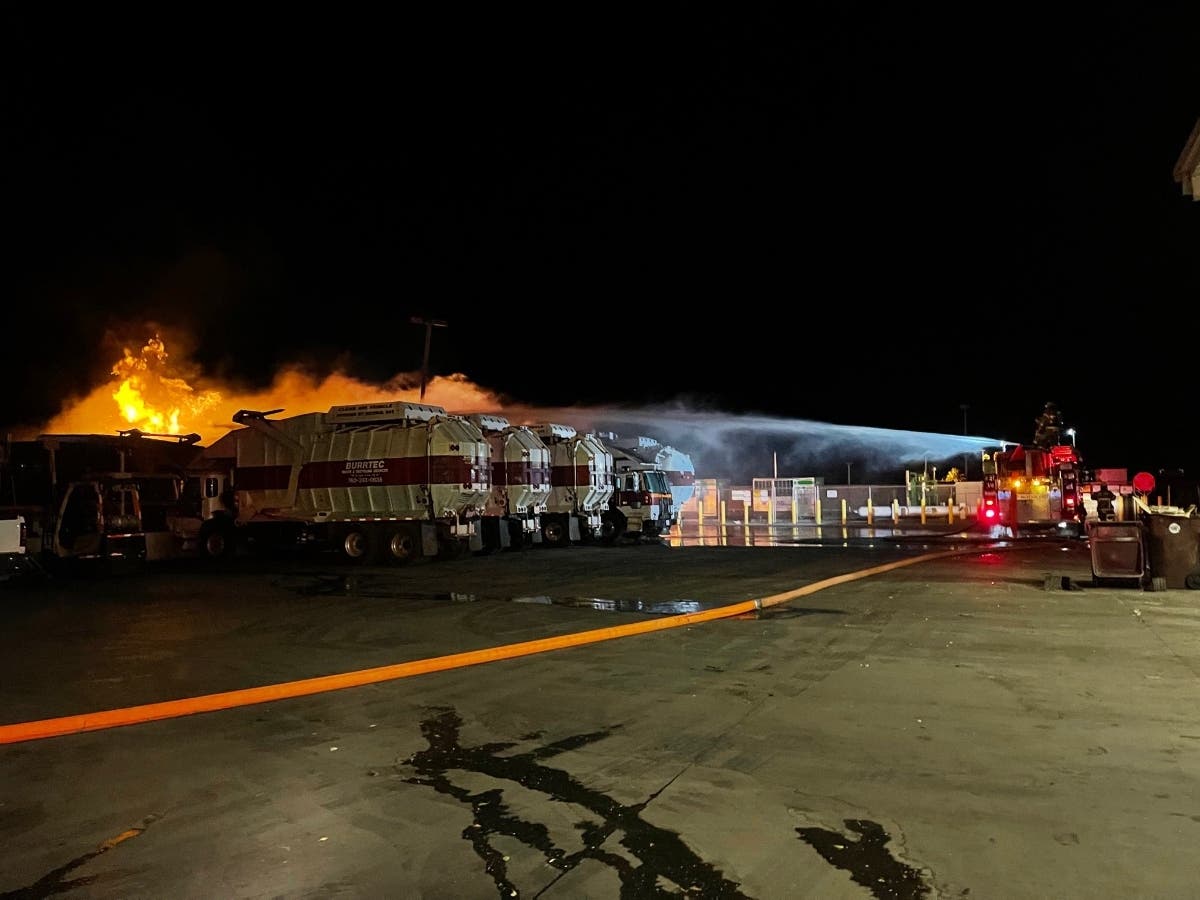 Cal Fire/Riverside County Fire Department crews battle the trash truck fires Sunday night in Coachella.