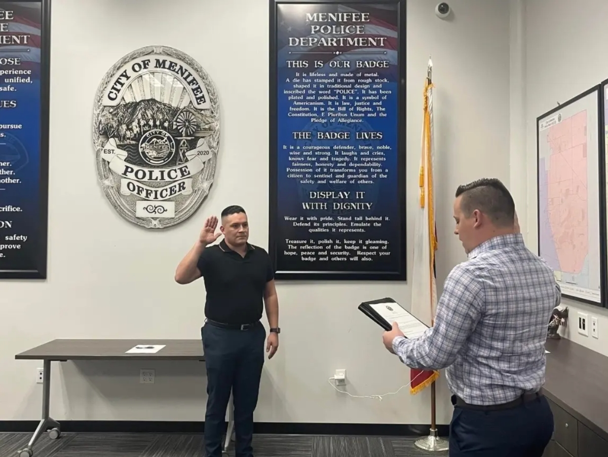Juan Jose Pesina Jr. (left) during his December 2022 swearing-in at the Menifee Police Department.