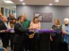 Charles Kapur, secretary of the Greater Reston Chamber of Commerce, cuts the ribbon on the Chamber's new offices.