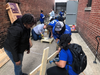 The Mission Continues volunteers assemble a picnic table Thursday outside Calvary Women’s Services' Anacostia home.