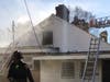 D.C. firefighters work to extinguish a fire that originated in the kitchen of a Shepherd Park home.
