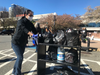 A volunteer uses a library cart to transport donated items to the Central Library.