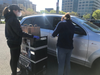 Volunteers follow social distancing guidelines as they accept donations.