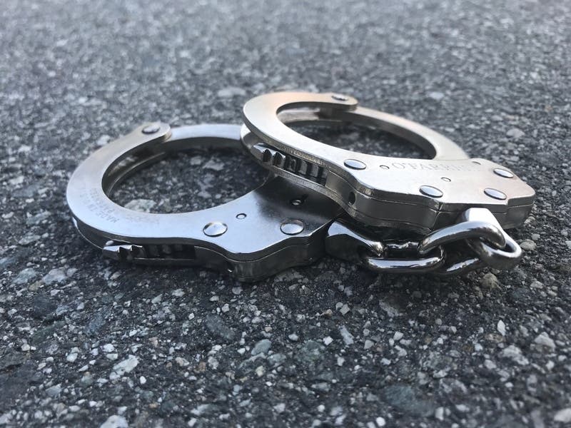 D.C. Police arrested a Northeast man after they say he threw a Molotov cocktail at an unmarked police cruiser on Wednesday night.