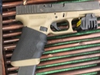 Police recovered two weapons that had been in the possession of the suspect charged in Monday's carjacking.