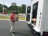 A woman drops off a donation at the Stuff the Bus event Tuesday at the North County Government Center.