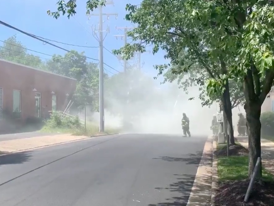 Arlington County firefighters extinguished a burning fire pole near Fort Myer Monday afternoon.