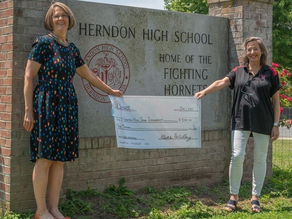 Rachel Williams, scholarship director for The Closet, presents a check for $9,000 to Herndon High School. Accepting the check is Deb Peirce, college and career center specialist and college partnership program advocate, at Herndon.
