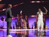 Malik DOPE, right, shares the stage with "America's Got Talent" host Terry Crews.